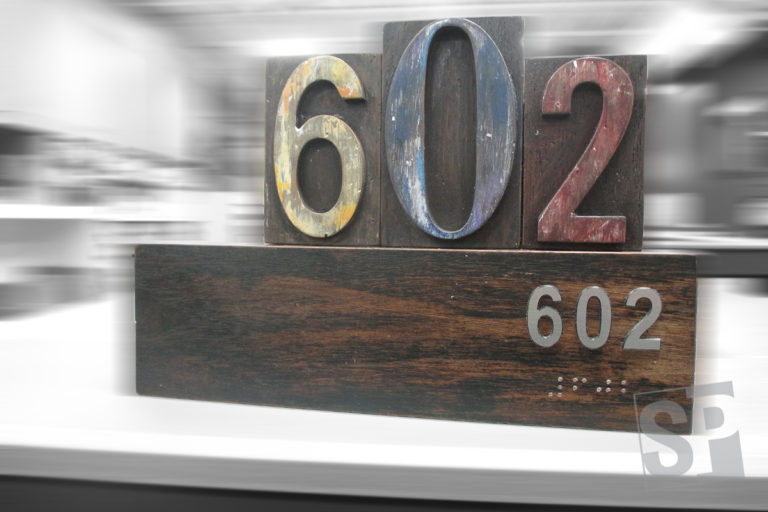 custom wood ADA room number paques with routed letters