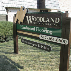 double sided redwood sandblasted sign with dinensional flooring and rider panel