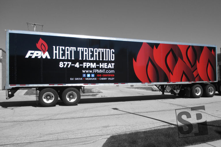 fpm heat treating tractor and trail wrap with custom flame graphics and company logos