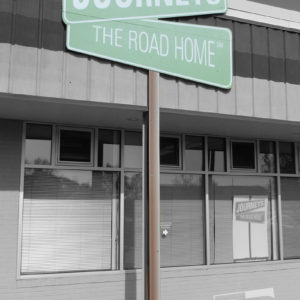 journeys the road home main mount sign made to look like a street sign to incorporate a support post into the application of the sign