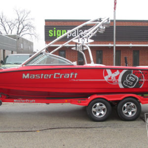 mastercraft x9 custom metallic silver and black vinyl ski and wakeboard boat