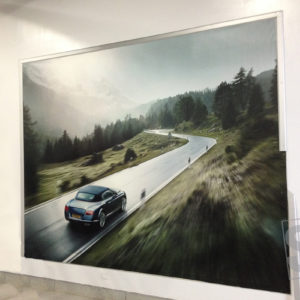 stretched canvas printed install at a auto dealership